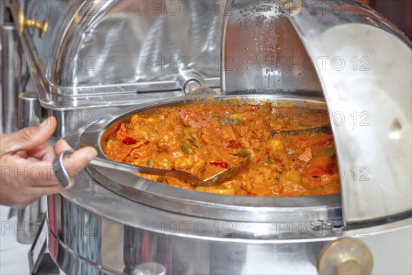 Mixed chicken curry with vegetable in thick tomato gravy