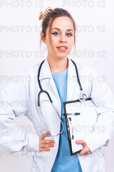 Portrait of smiling female doctor in medical gown standing isolated on white