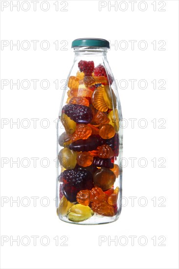 Glass bottle with fruit jelly on white