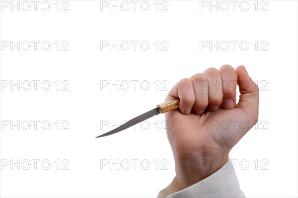 Hand holding a knife in hand on a white background