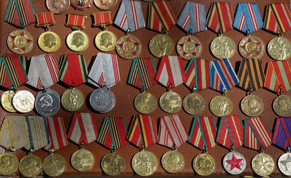 Veteran medals for their labour scattered on a table