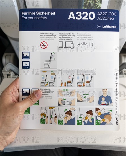 Boarding card with safety instructions in a Lufthansa A320 aircraft