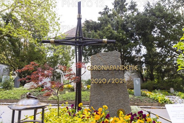 Grave with the word Corona Pandemie on the gravestone