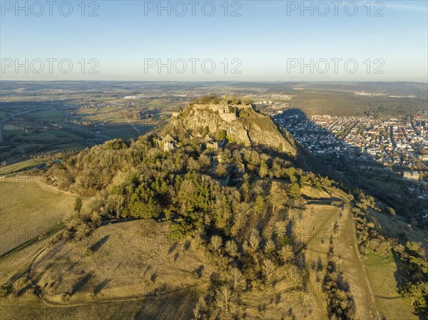 The volcanic cone Hohentwiel with the castle ruins illuminated by the evening sun