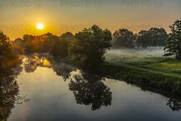 Sunrise and morning fog over the Ems near Telgte