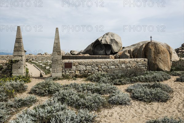 Granite rocks and cemetery on the beach