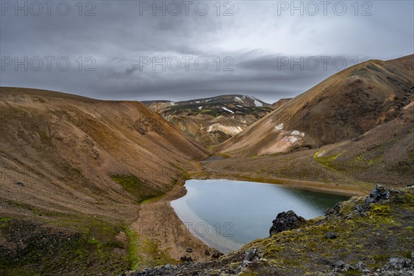 Small lake between rhyolite mountains