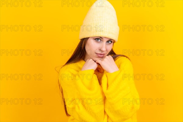 Thinking woman with many ideas with copyspace on yellow background