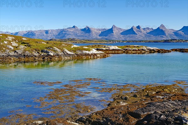 Small bay and view of the Seven Sisters Mountains