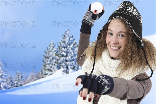 Woman throws a snowball