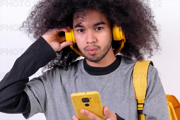 Young man with afro hair on white background