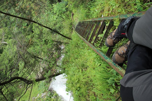 A tourist in the beautiful gorges of the Slovak Paradise National Park. Slovakia