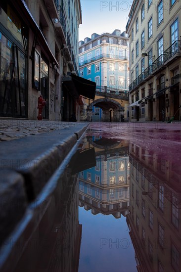 Old houses in narrow alleys and historic streets. Old house fronts in the morning and sunshine in the party alleyway R. Nova do Carvalho