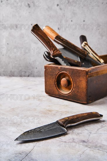 Wooden box with different kinds of knives