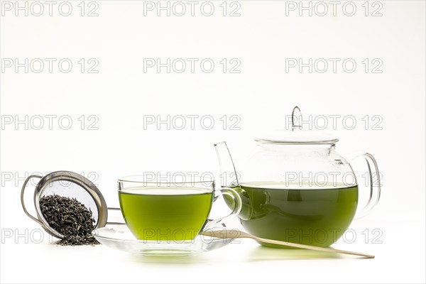 Green tea in glass pot and cup