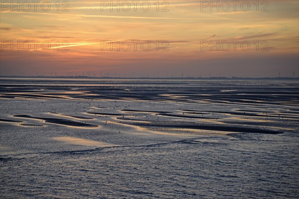 View over the Wadden Sea at low tide to the mainland