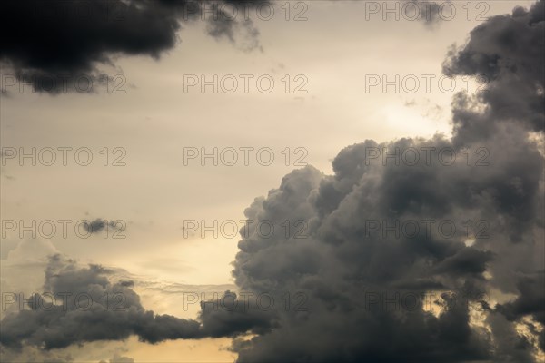 Grey clouds spread rain in the evening sky. Alsace