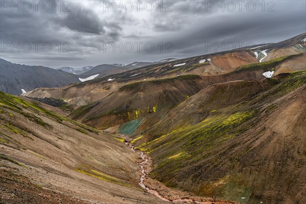Small river between colourful rhyolite mountains