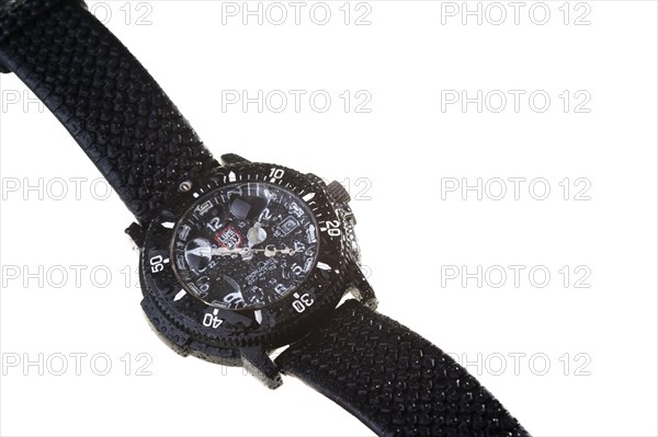 A waterproof wristwatch with water droplets