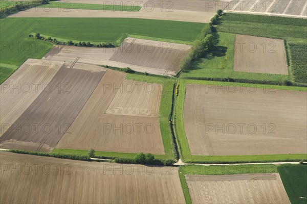 Aerial view over agricultural landscape showing fields