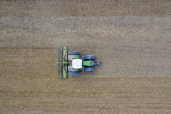 Tractor with rotary harrow