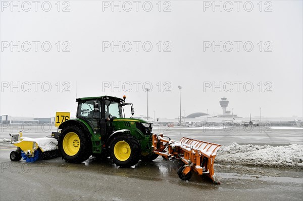 Snow clearing machines and snow removal tractors clearing snow on the east apron