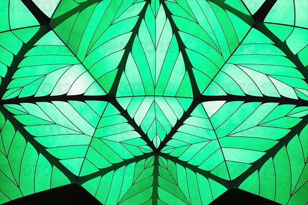 Incidence of light through a green tent dome