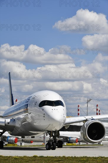 Singapore Airlines aircraft taxiing on taxiway to runway south