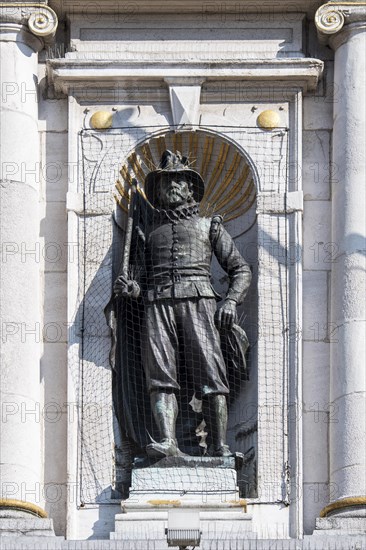 Statue protected with anti-bird net and anti roosting spikes against city pigeons at the Nederlands Toneel Gent