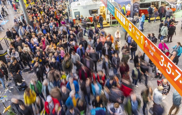 Entrance to the travel trade fair with many visitors