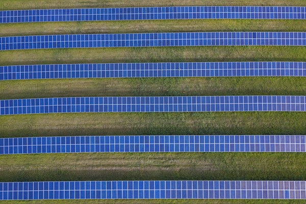 Aerial view over solar panels of photovoltaic power station