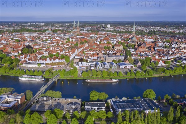 Aerial view over the river Trave and old town and churches of the Hanseatic City of Luebeck in spring