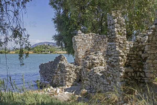 Ruined walls of ancient Roman city on the shore of Lake Butrint