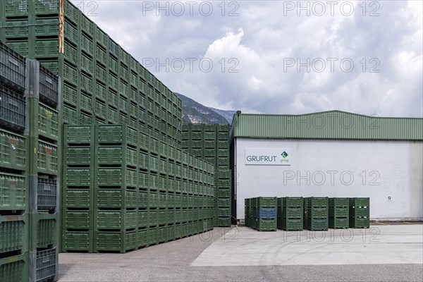 Vegetable crates and fruit boxes for the apple harvest pile up at the GRUFUT fruit cooperative in Salurn