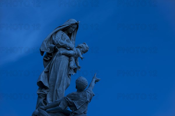 The statue Notre-Dame des naufrages at the Pointe du Raz at night