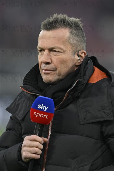 TV pundit Lothar Matthaeus in interview with microphone