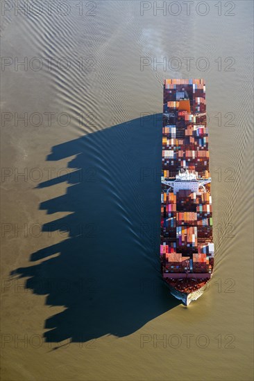 Container ships in the shipping channel of the Elbe