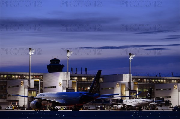 Lufthansa Airbus A350-900 New Livery being towed to position to Terminal 2 by tow truck at dusk