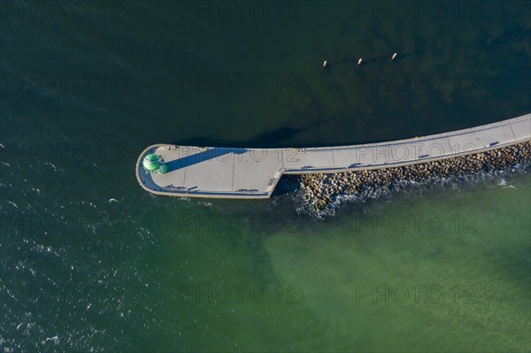 Aerial view over harbour entrance with lighthouse Travemuende Nordmole