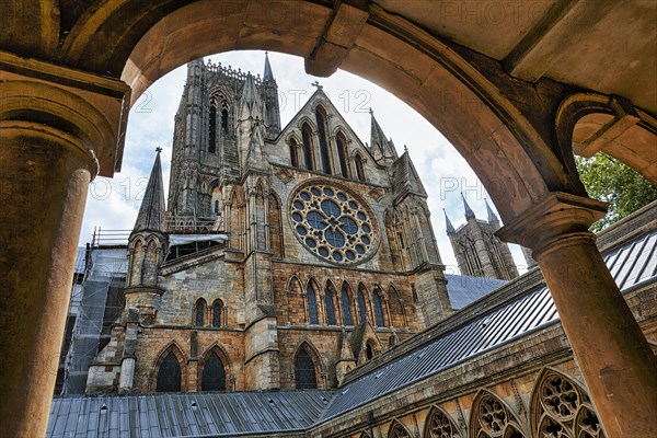 View through an arch in the cloister on Lincoln Cathedral