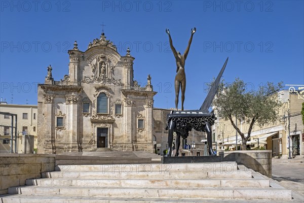 Salvador Dali sculpture in front of Church of San Francesco dAssisi in the historic city centre of Matera