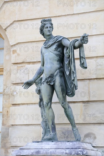 Statue of a naked man in front of the garden facade of the Corps de Logis