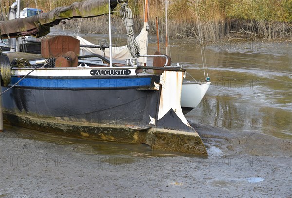 Ship stuck in the mud at low tide in Wischhafen