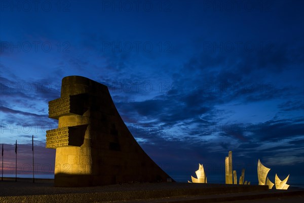 Second World War Two Omaha Beach monument and sculpture Les Braves at Saint-Laurent-sur-Mer at night