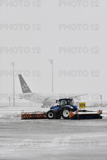 Snow clearing machines and snow removal tractors clearing snow on the east apron