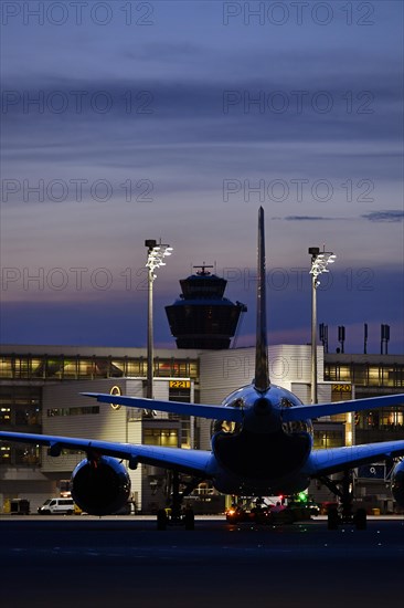 Lufthansa Airbus A350-900 New Livery being towed to position to Terminal 2 by tow truck at dusk