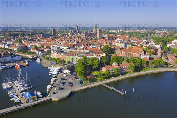 Aerial view over the waterfront and marina of the Hanseatic City of Stralsund along the Strelasund in summer