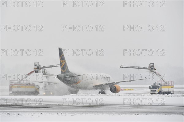 Aircraft de-icing in winter in front of take-off