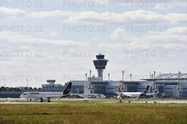 Lufthansa and Egypt Air aircraft with runway north