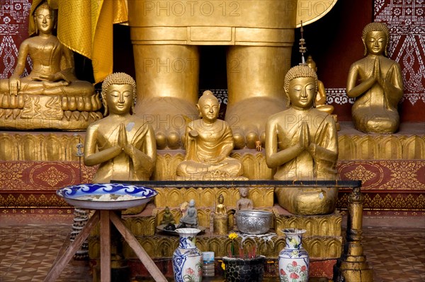 Various Buddha statues inside Luang Prabangs Wat Saen temple